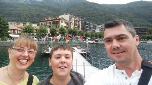 Behind us are the metal flowers in Omegna, on Lake Orta