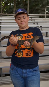Me holding a baby alligator.