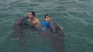 Us kising a dolphin